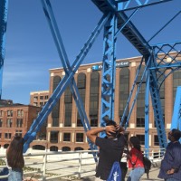 Group of students posing near Blue Bridge